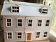 A Large Vintage Dolls House With Furniture And Dolls