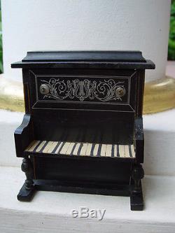 Antique dollhouse piano dated about 1900 made of wood