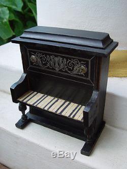 Antique dollhouse piano dated about 1900 made of wood