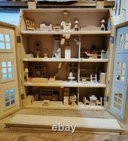 Classic four storey wooden dolls house with all furniture