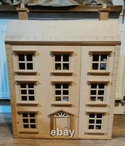 Classic four storey wooden dolls house with all furniture