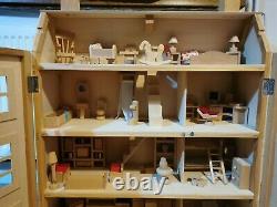 Classic four storey wooden dolls house with all furniture