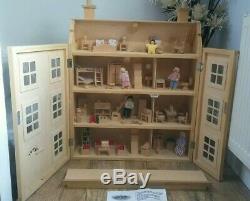 Classic four storey wooden dolls house with all furniture with people