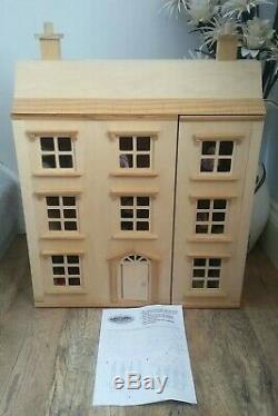 Classic four storey wooden dolls house with all furniture with people