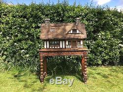 Stunning handmade, thatched country cottage dolls house