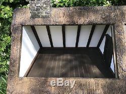 Stunning handmade, thatched country cottage dolls house